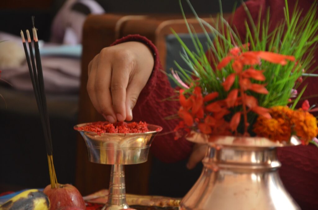 a person putting red food in a bowl